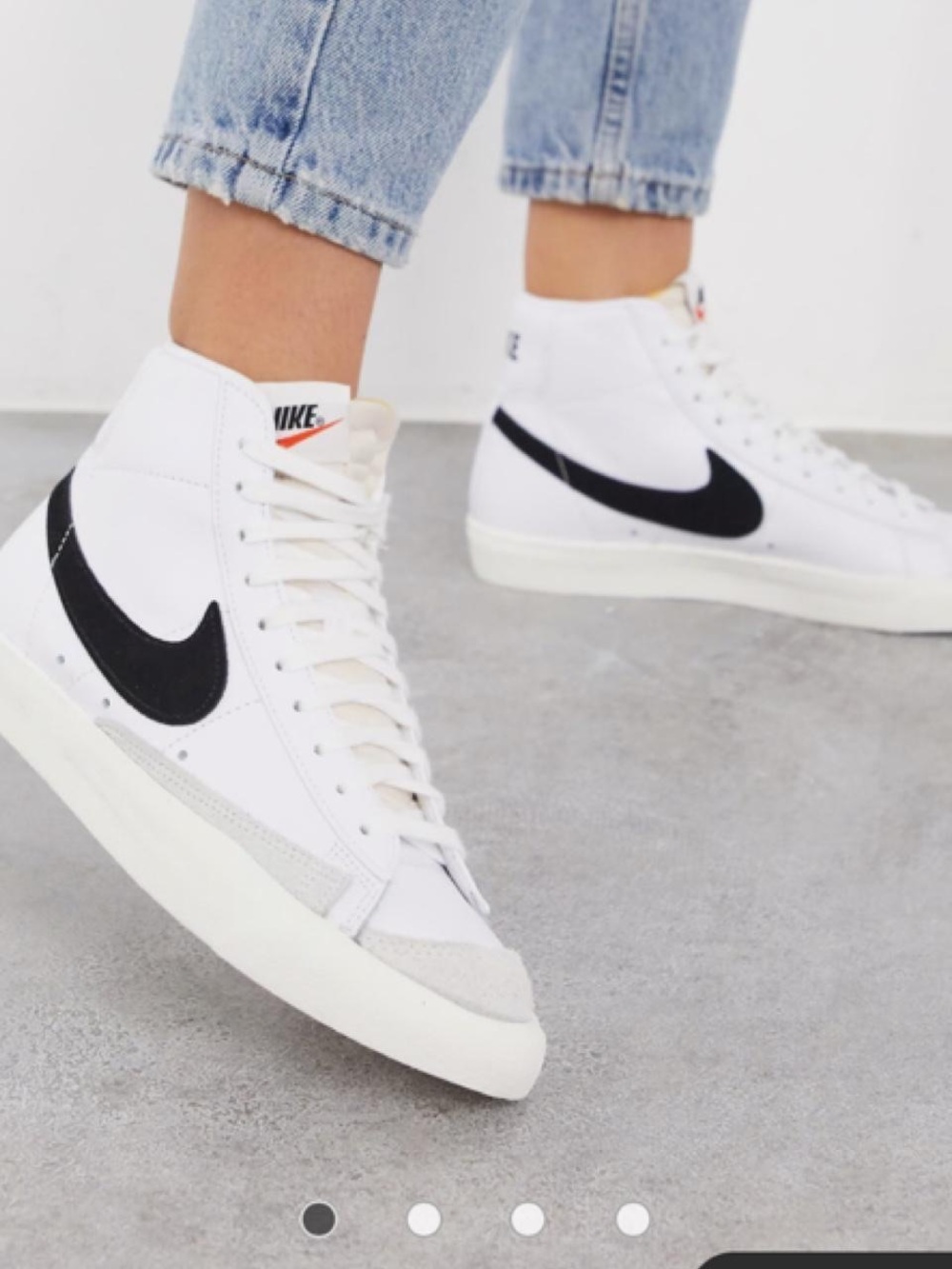 Nike White High-Top Sneakers with Black Swoosh